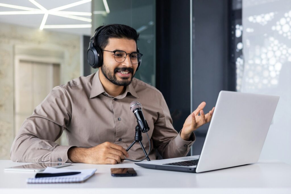 Businessman recording training video online course, man smiling in talking using professional